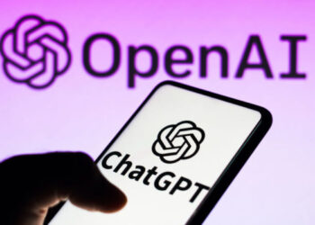 BRAZIL - 2023/04/05: In this photo illustration, the ChatGPT logo is seen displayed on a smartphone and the OpenAI company logo on background. (Photo Illustration by Rafael Henrique/SOPA Images/LightRocket via Getty Images)