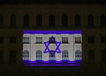 Bucharest (Romania), 09/10/2023.- The flag of the State of Israel is projected onto the facade of the Palace of the Romanian Parliament building, as a sign of solidarity, in Bucharest, Romania, 09 October 2023. More than 700 Israelis were killed and over 2,000 were injured since the Islamist movement Hamas carried out an unprecedented attack on southern Israel on 07 October, the Israeli army said. According to Palestinian officials, more than 700 people were killed and nearly 4,000 were injured as a result of Israel'Äôs retaliatory raids and air strikes in the Palestinian enclave. (Laos, Rumanía, Bucarest) EFE/EPA/Robert Ghement