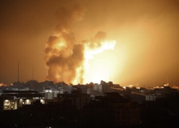 Fire and smoke rises above buildings during an Israeli air strike in Gaza City on October 8, 2023. At least 200 Israelis died in a surprise large-scale attack by the Palestinian militant group Hamas on October 7, 2023, the army said, as Prime Minister Benjamin Netanyahu vowed to reduce the group's Gaza hideouts to "rubble". (Photo by EYAD BABA / AFP)