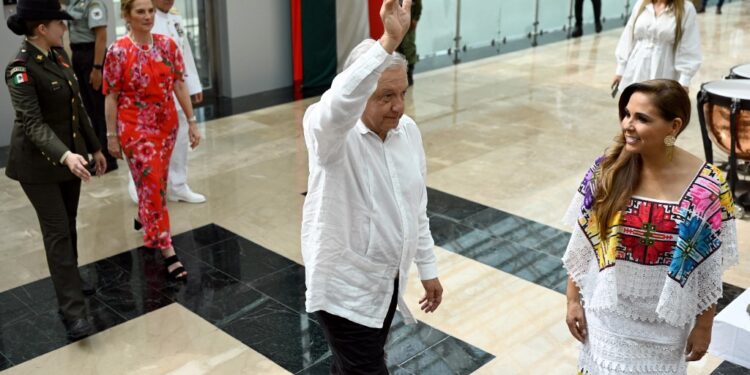Mexico's President Andres Manuel Lopez Obrador waves before the inauguration of the Felipe Carrillo Puerto International Aiport in Tulum, Quintana Roo state, Mexico on December 1, 2023. (Photo by ALFREDO ESTRELLA / AFP)