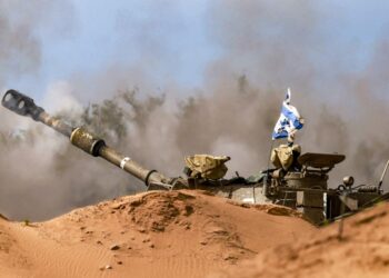 An Israeli army self-propelled artillery howitzer fires rounds from a position near the border with the Gaza Strip in southern Israel on December 24, 2023. (Photo by Menahem KAHANA / AFP)