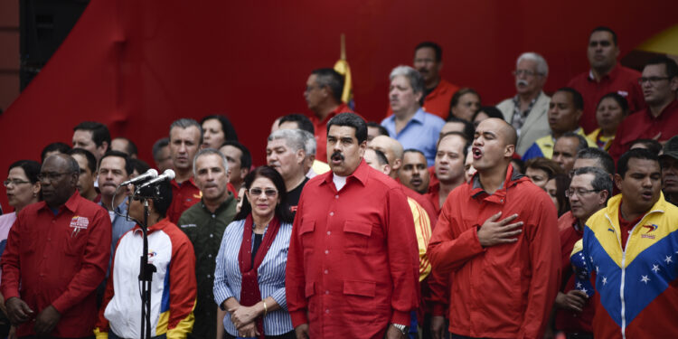 CARACAS - VENEZUELA - OCTOBER 25: President Maduro with his wife Cilia Flores(L) and Hector Rodriguez (R)  during a March