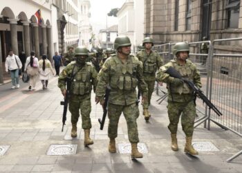 Soldiers are deployed in downtown Quito on January 9, 2024, a day after Ecuadorean President Daniel Noboa declared a state of emergency following the escape from prison of a dangerous narco boss. At least four police officers were kidnapped in Ecuador following a declaration of a 60-day state of emergency on January 8 after dangerous gang leader Adolfo Macias, also known as "Fito," escaped from maximum security detention. (Photo by Rodrigo BUENDIA / AFP)