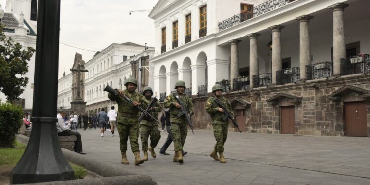 Soldiers patrol the square in front of Carondelet Presidential Palace in downtown Quito on January 9, 2024, a day after Ecuadorean President Daniel Noboa declared a state of emergency following the escape from prison of a dangerous narco boss. At least four police officers were kidnapped in Ecuador following a declaration of a 60-day state of emergency on January 8 after dangerous gang leader Adolfo Macias, also known as "Fito," escaped from maximum security detention. (Photo by Rodrigo BUENDIA / AFP)