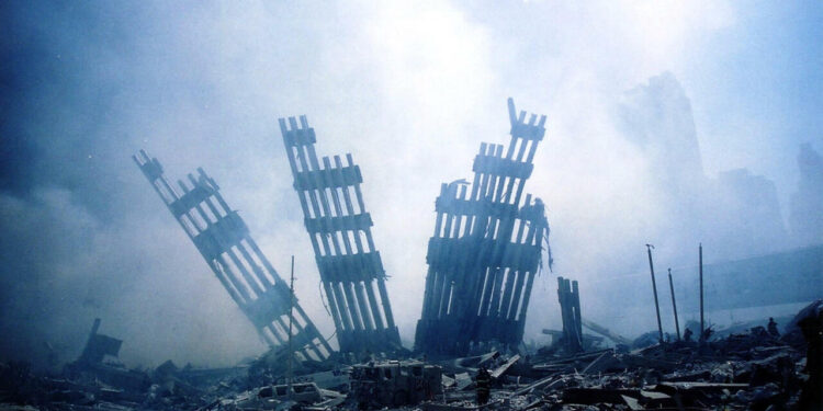 (FILES) In this file photo taken on September 11, 2001, the rubble of the twin towers of the World Trade Center smoulder following a terrorist attack in lower Manhattan, New York. - The remains of two more victims of 9/11 have been identified, thanks to advanced DNA technology, New York officials announced on September 8, 2021, just days before the 20th anniversary of the attacks. The office of the city's chief medical examiner said it had formally identified the 1,646th and 1,647th victim of the al-Qaeda attacks on New York's Twin Towers which killed 2,753 people. They are the first identifications of victims from the collapse of the World Trade Center since October 2019. (Photo by Alexandre FUCHS / AFP)