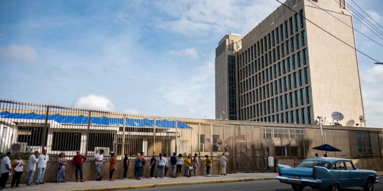 Cubans queue to enter the US embassy in Havana on January 9, 2024. The US Customs and Border Protection agency said on January 27, 2024, that it had registered some 153,600 irregular entries from Cuba in 2023. Another 67,000 entered legally under a family reunification program introduced a year ago by the administration of Joe Biden. And there are yet more, undetected, who arrive on rafts and manage to enter the United States under the radar. Together with the 313,506 who left in 2022, this recent mass movement represented "the largest number of Cuban migrants recorded in two years since the beginning of the post-revolutionary Cuban exodus in 1959," said Jorge Duany, Director of the Cuban Research Institute at Florida International University. (Photo by Yamil LAGE / AFP)