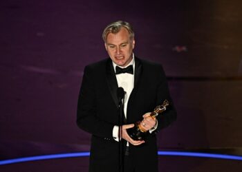 British director Christopher Nolan accepts the award for Best Director for "Oppenheimer" onstage during the 96th Annual Academy Awards at the Dolby Theatre in Hollywood, California on March 10, 2024. (Photo by Patrick T. Fallon / AFP)
