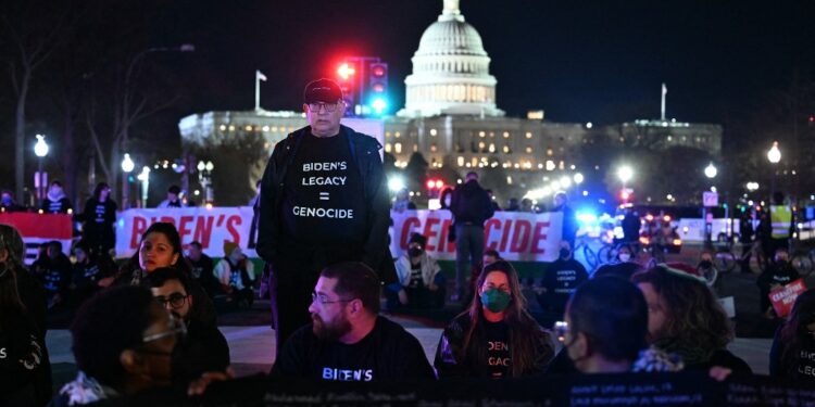Pro-Palestinian demonstrators block a street during a protest ahead of US President Joe Biden's State of the Union address near the US Capitol in Washington, DC, on March 7, 2024. (Photo by PEDRO UGARTE / AFP)