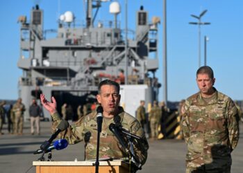 US Army Colonel Sam Miller, Commander of the 7th Transportation Brigade (Expeditionary) speaks to members of the press near four US Army ships before they depart from the Joint Base Langley-Eustis during a media preview of the 7th Transportation Brigade deployment in Hampton, Virginia, on March 12, 2024. The Brigade is deploying to the Middle East to assist in the multinational humanitarian aid corridor for Gaza. (Photo by ROBERTO SCHMIDT / AFP)
