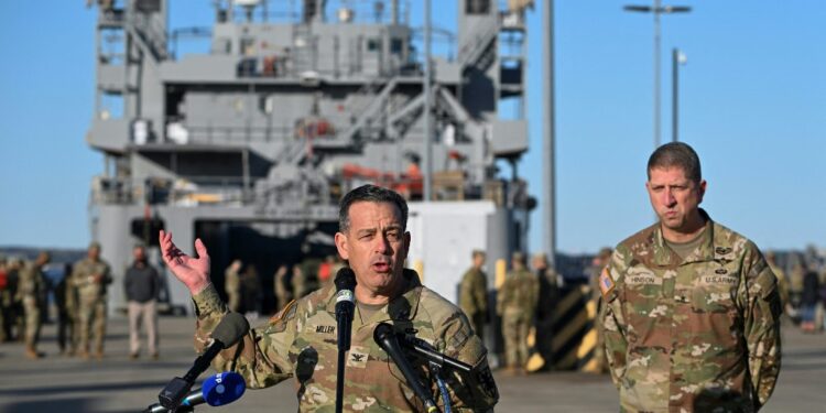 US Army Colonel Sam Miller, Commander of the 7th Transportation Brigade (Expeditionary) speaks to members of the press near four US Army ships before they depart from the Joint Base Langley-Eustis during a media preview of the 7th Transportation Brigade deployment in Hampton, Virginia, on March 12, 2024. The Brigade is deploying to the Middle East to assist in the multinational humanitarian aid corridor for Gaza. (Photo by ROBERTO SCHMIDT / AFP)
