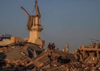 Gaza (---), 06/05/2024.- Palestinians sit among the rubble of a destroyed house along Salah Al Din road between Rafah and Khan Younis town, southern Gaza Strip, 06 May 2024 (issued 07 May 2024). The Israel Defence Forces (IDF) on 06 May called on residents of eastern Rafah to 'temporarily' evacuate. On 07 May the IDF confirmed that its ground troops began an overnight operation targeting Hamas militants and infrastructure within specific areas of eastern Rafah, taking operational control of the Gazan side of the Rafah crossing based on intelligence information. More than 34,600 Palestinians and over 1,455 Israelis have been killed, according to the Palestinian Health Ministry and the IDF, since Hamas militants launched an attack against Israel from the Gaza Strip on 07 October 2023, and the Israeli operations in Gaza and the West Bank which followed it. EFE/EPA/MOHAMMED SABER