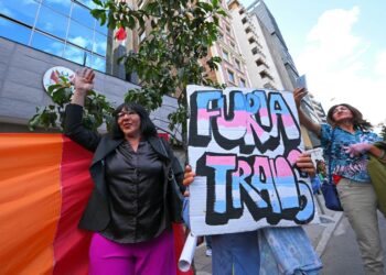 Protestors attend a rally in front of the Peruvian embassy to commemorate the International Day against Homophobia, Biphobia, and Transphobia in Quito on May 17, 2024. The Peruvian government is under fire from LGBTQ+ groups which have called a protest on April 17 against a new decree listing transsexualism as a "mental disorder". (Photo by Rodrigo BUENDIA / AFP)