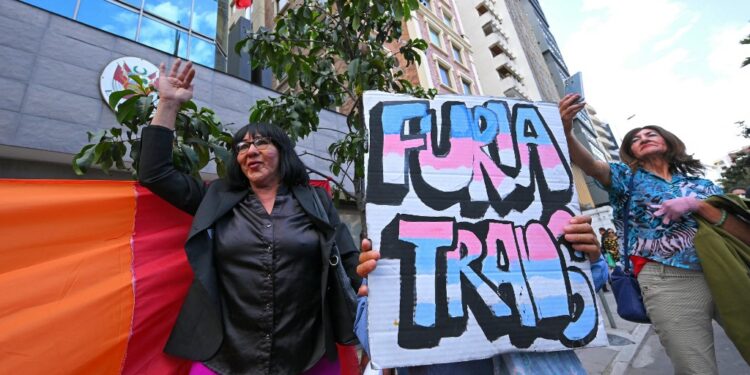 Protestors attend a rally in front of the Peruvian embassy to commemorate the International Day against Homophobia, Biphobia, and Transphobia in Quito on May 17, 2024. The Peruvian government is under fire from LGBTQ+ groups which have called a protest on April 17 against a new decree listing transsexualism as a "mental disorder". (Photo by Rodrigo BUENDIA / AFP)