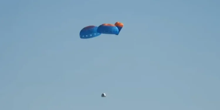 Esta captura de pantalla, tomada del webcast de Blue Origin, muestra el paracaídas desplegado. Captura de pantalla: Blue Origin