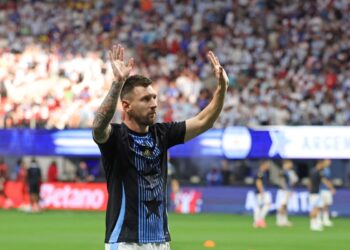 Argentina's forward #10 Lionel Messi acknowledges supporters as he warms up ahead of the Conmebol 2024 Copa America tournament group A football match between Argentina and Canada at Mercedes Benz Stadium in Atlanta, Georgia, on June 20, 2024. (Photo by CHARLY TRIBALLEAU / AFP)