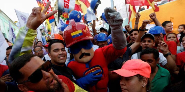 A man dressed as Super Moustache, a character inspired by Venezuela's President Nicolas Maduro gestures during a rally of the United Socialist Party of Venezuela (PSUV) in support of Maduro, in Caracas, Venezuela June 20, 2024. REUTERS/Leonardo Fernandez Viloria/File Photo Purchase Licensing Rights