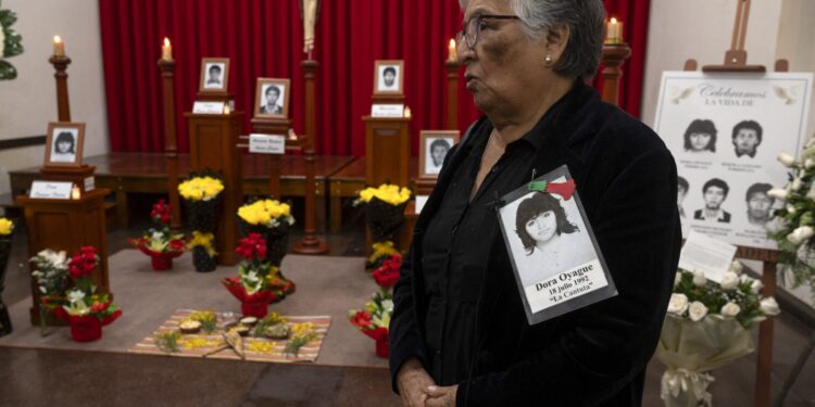 Pilar Fierro, mother of Dora Oyague, one of five students killed by a military squad during a raid at a university campus 31 years ago attends a religious ceremony in their honour on September 1, 2023, in Lima, after the remains were handed over to relatives by the Peruvian prosecutor's office. On July 18, 1992, soldiers entered the Enrique Guzmán y Valle National University -often called La Cantuta- in Chosica, a small town east of Lima and detained nine students and a professor accused of being part of the Shining Path (Sendero Luminoso) Maoist armed group. In 1993 prosecutors found the first human remains in a common grave, which served to condemn former president Alberto Fujimori as a co-perpetrator of qualified homicide, torture and forced disappearance of persons. The court also determined that none of the 10 victims in the La Cantuta case belonged to terrorist groups. (Photo by Cris BOURONCLE / AFP)