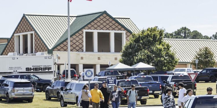 Winder (United States), 04/09/2024.- People leave the scene of a shooting at Apalachee High School in Winder, Georgia, USA, 04 September 2024. At least four people died and nine injured after a shooting at the school, the Georgia Bureau of Investigation (GBI) announced on social media platform X, formerly Twitter, adding that one suspect was in custody. EFE/EPA/ERIK S. LESSER