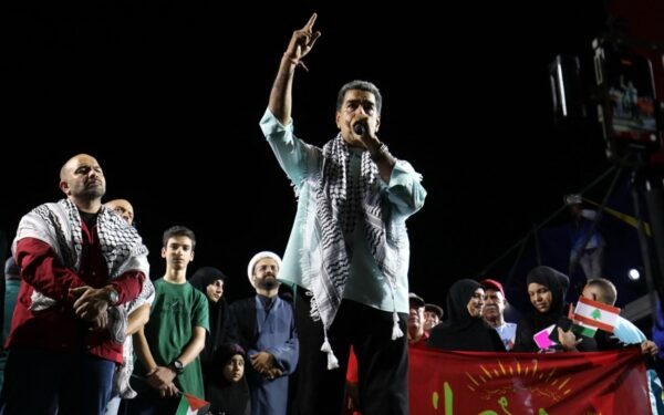 This handout picture released by Venezuelan Presidency shows Venezuelan President Nicolas Maduro speaking during a rally two months after the disputed presidential election in La Guaira, Venezuela on September 28, 2024. - Maduro, who was elected for a third consecutive term after a controversial election, said that opposition leader Maria Corina Machado, who has denounced electoral fraud, is preparing to leave the country. (Photo by ZURIMAR CAMPOS / Venezuelan Presidency / AFP) / RESTRICTED TO EDITORIAL USE - MANDATORY CREDIT "AFP PHOTO / VENEZUELAN PRESIDENCY " - NO MARKETING NO ADVERTISING CAMPAIGNS - DISTRIBUTED AS A SERVICE TO CLIENTS