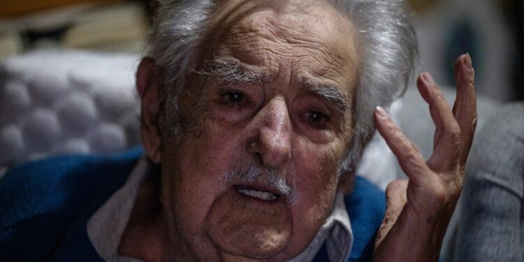 Uruguay's former President (2010-2015) Jose Mujica gestures as he gives an AFP interview at his house in Montevideo on November 28, 2024. - He is perhaps the most famous Uruguayan in the world, but that doesn't faze him. I'm not a phenomenon; I'm an ordinary guy with some eccentricities (...) a freak, the 89-year-old former president told AFP, with a thousand battles and a brand new victory: that of his running mate Yamandú Orsi in Sunday's presidential elections, which allowed the left to return to power in this country of 3.4 million inhabitants. (Photo by Eitan ABRAMOVICH / AFP)