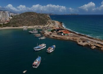 Aerial view of Pier Juan Griego in Margarita Island, Nueva Esparta State, Venezuela, on November 25, 2024. - Margarita, Venezuela's main island, is a Caribbean paradise in decline after years of devaluations, inflation, a pandemic, and the collapse of public services. (Photo by Juan BARRETO / AFP)