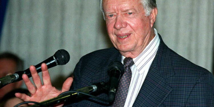 (FILES) Former US President Jimmy Carter speaks to reporters in Jerusalem on January 18, 1996. - Carter, the 100-year-old former US president and Nobel peace laureate who rose from humble beginnings in rural Georgia to lead the nation from 1977 to 1981, has died, his nonprofit foundation said on December 29, 2024. (Photo by AFP)