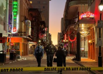 Police cordon off the area around the site of the overnight attack in the French Quarter of New Orleans, Louisiana, on January 1, 2025. - At least 10 people were killed and 30 injured Wednesday when a vehicle plowed overnight into a New year's crowd in the heart of the thriving New Orleans tourist district, authorities in the southern US city said. (Photo by Matthew HINTON / AFP)