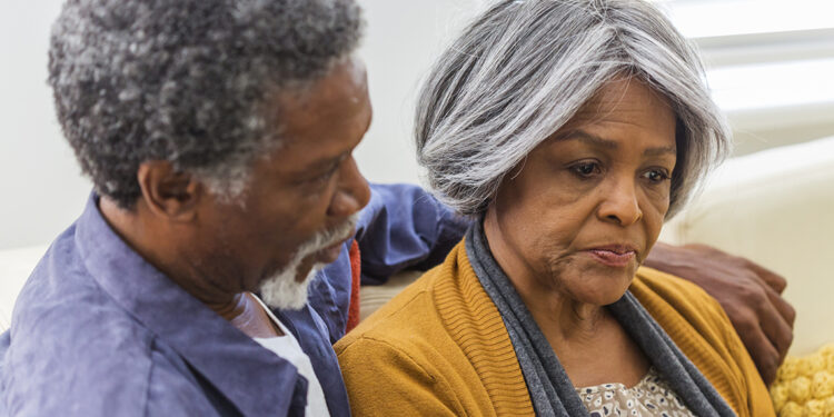 Loving African American couple being consoling each other at home