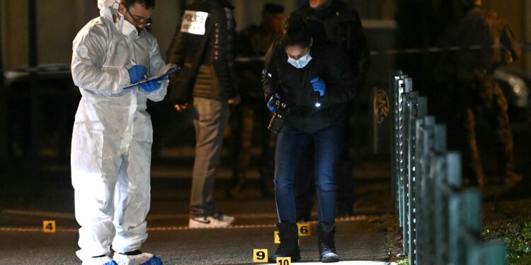 French forensic police work on the site of a knife attack where a man is suspected of killing one person and seriously wounding two police officers in Mulhouse, eastern France on February 22, 2025. Prosecutors said three more officers were lightly wounded in the attack in the city of Mulhouse, carried out by a 37-year-old suspect who is on a terror prevention watchlist, prosecutor told AFP. (Photo by SEBASTIEN BOZON / AFP)